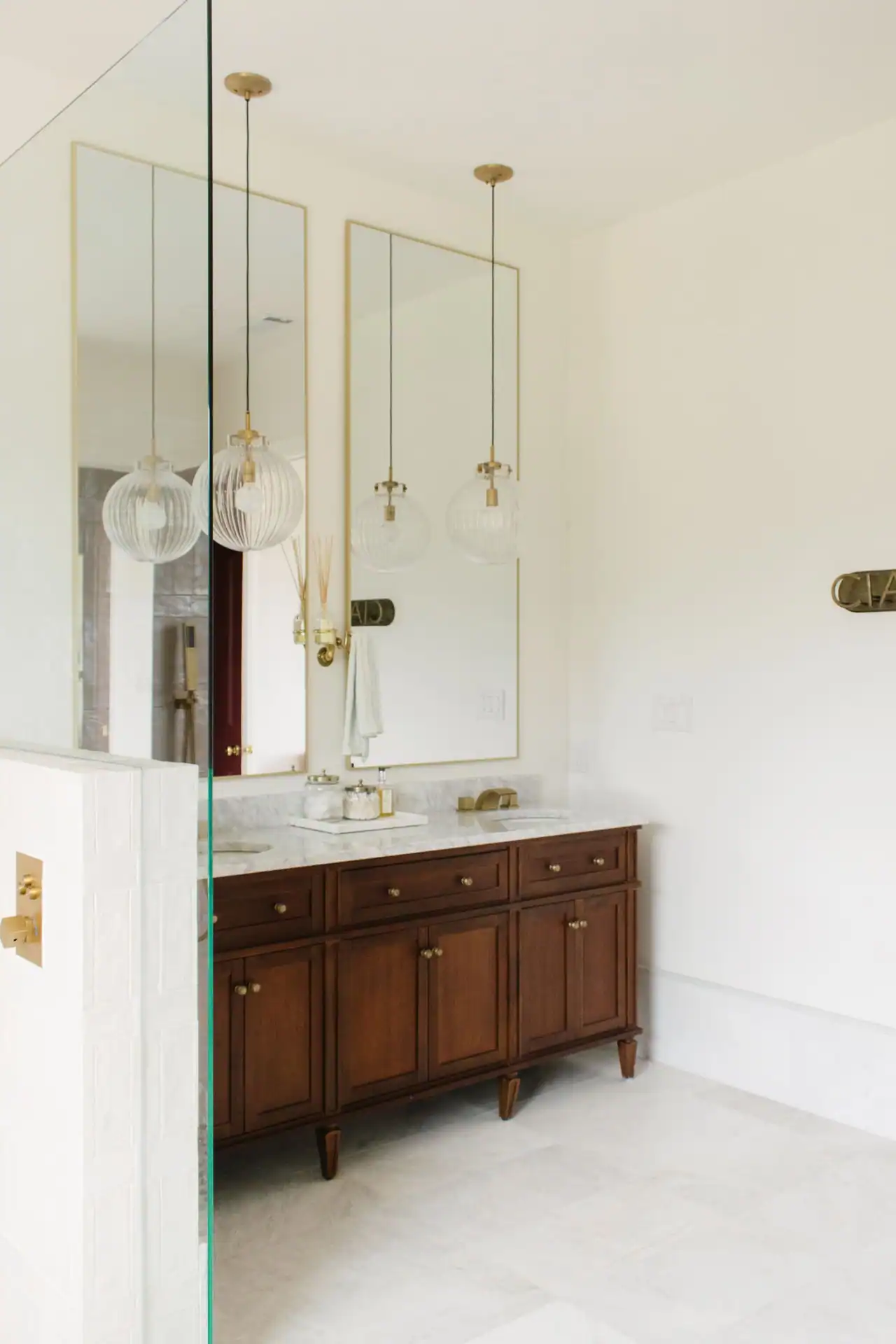 Vanity mirror and brass sconces in a bathroom at Canyonwood