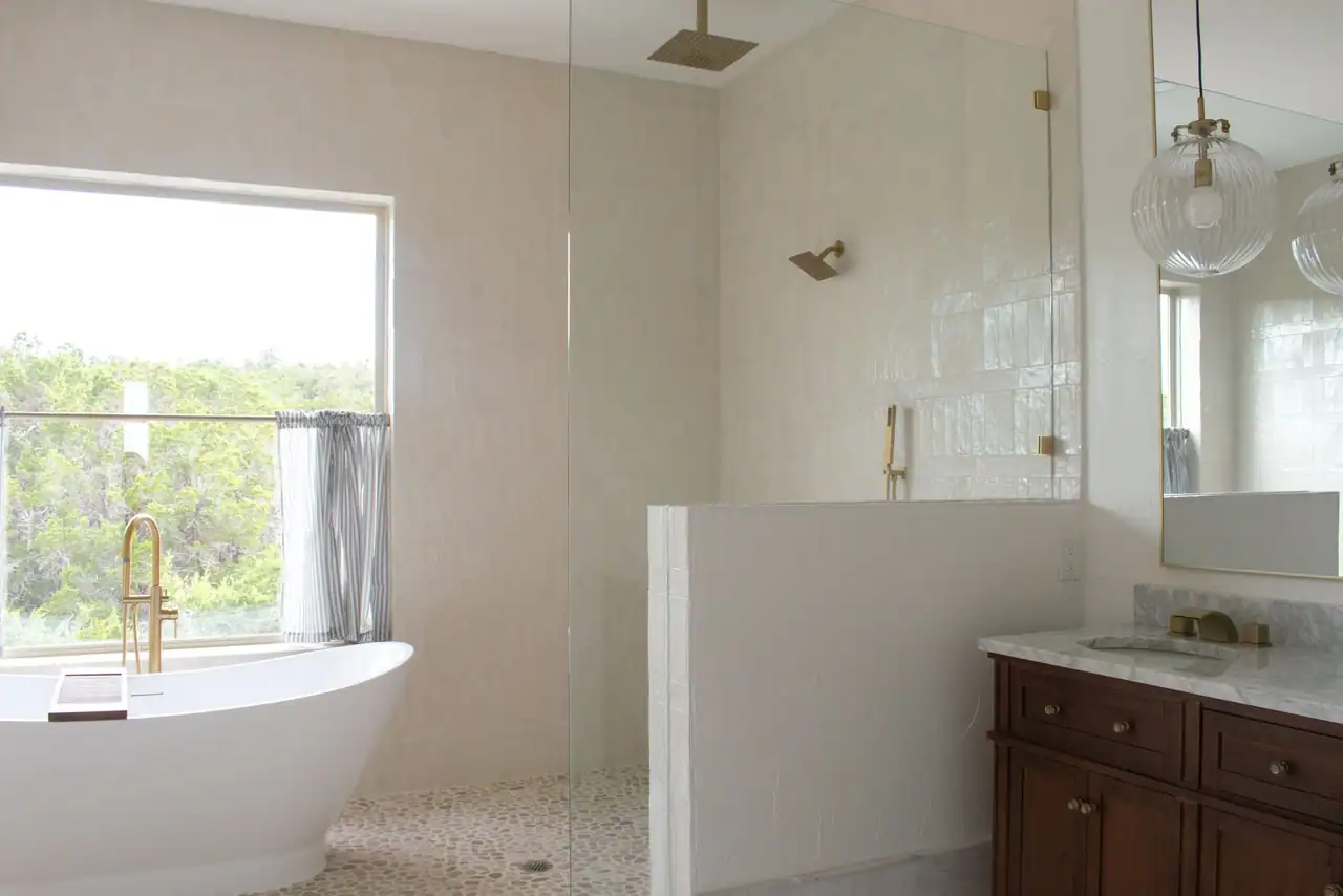 Bathroom with a walk-in shower and garden window at Canyonwood