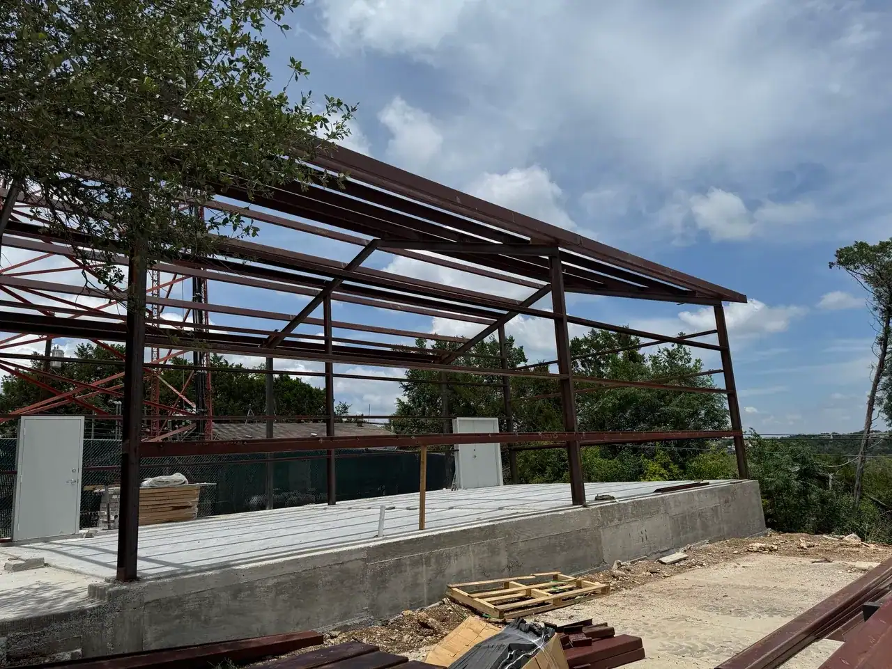 Steel church building frame on a concrete foundation during construction