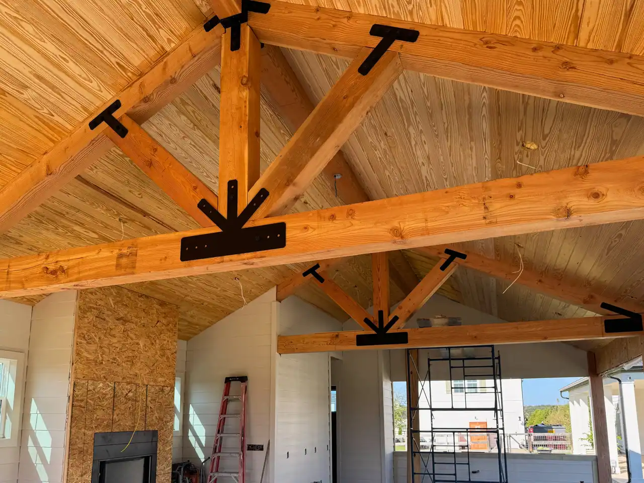 Wood ceiling and timber trusses over a pool cabana in Driftwood