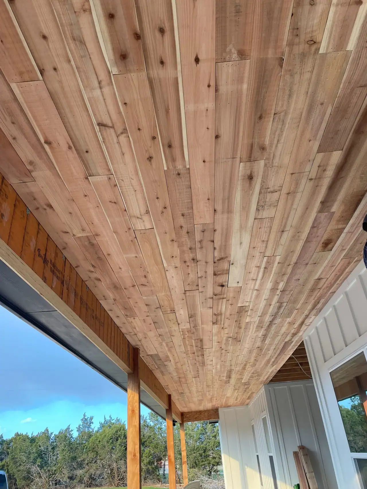 Wood plank porch ceiling