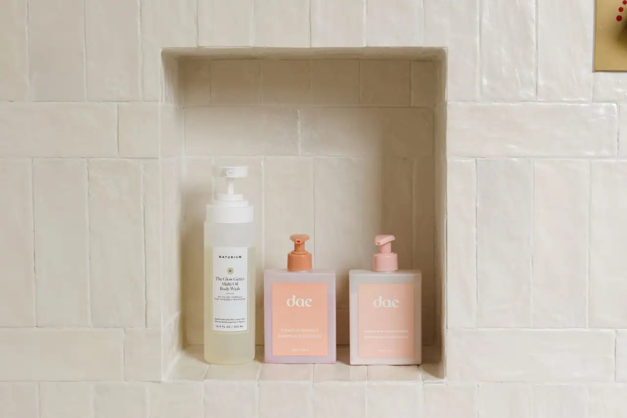 Zellige tile shower wall with a built-in shelf