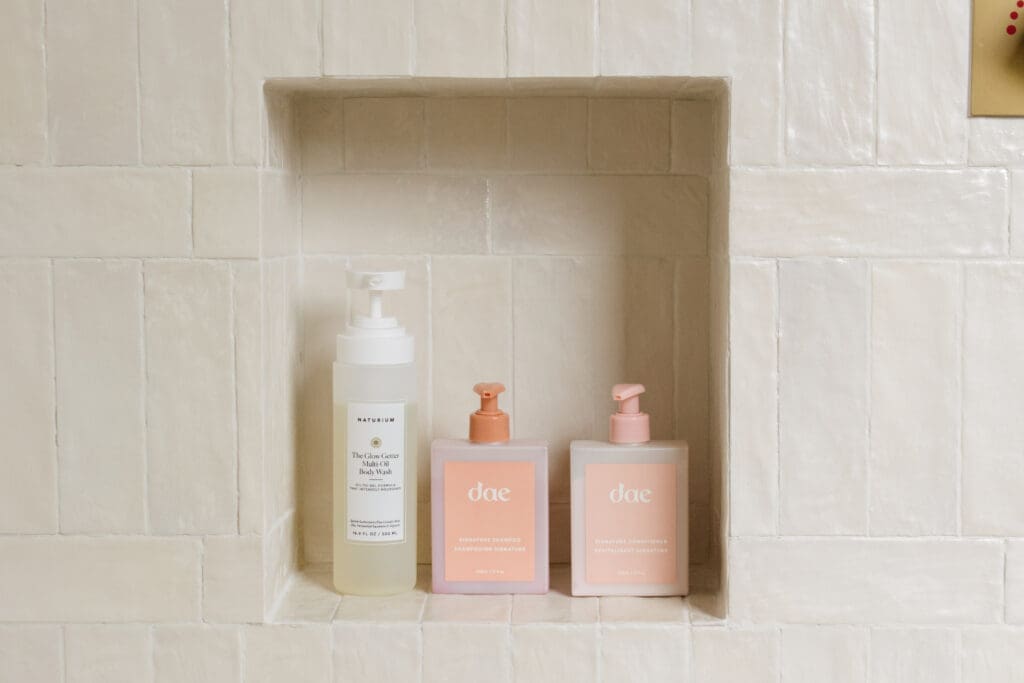 Zellige tile shower wall with a built-in shelf