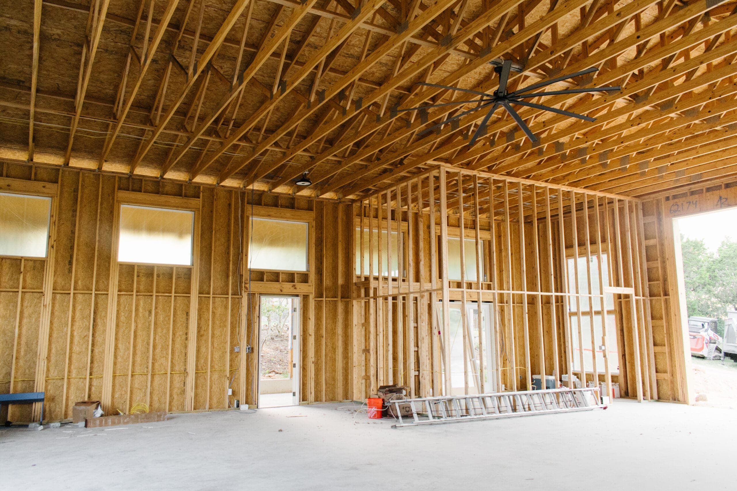 Wood stall framing inside a barn under construction