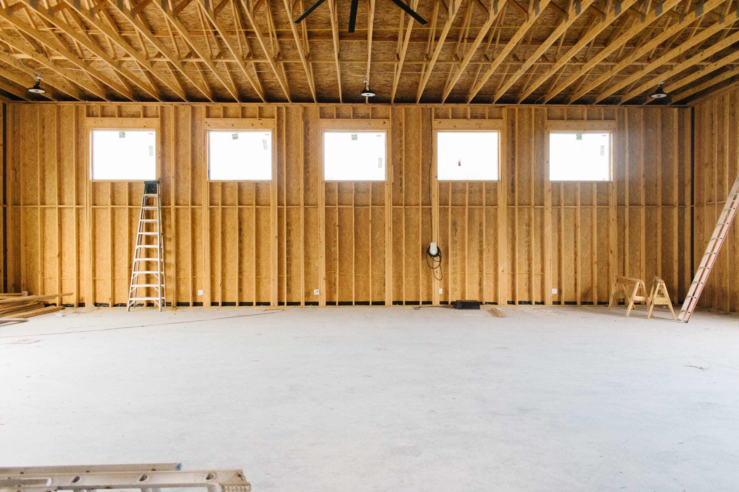 Framed interior walls of a barn under construction