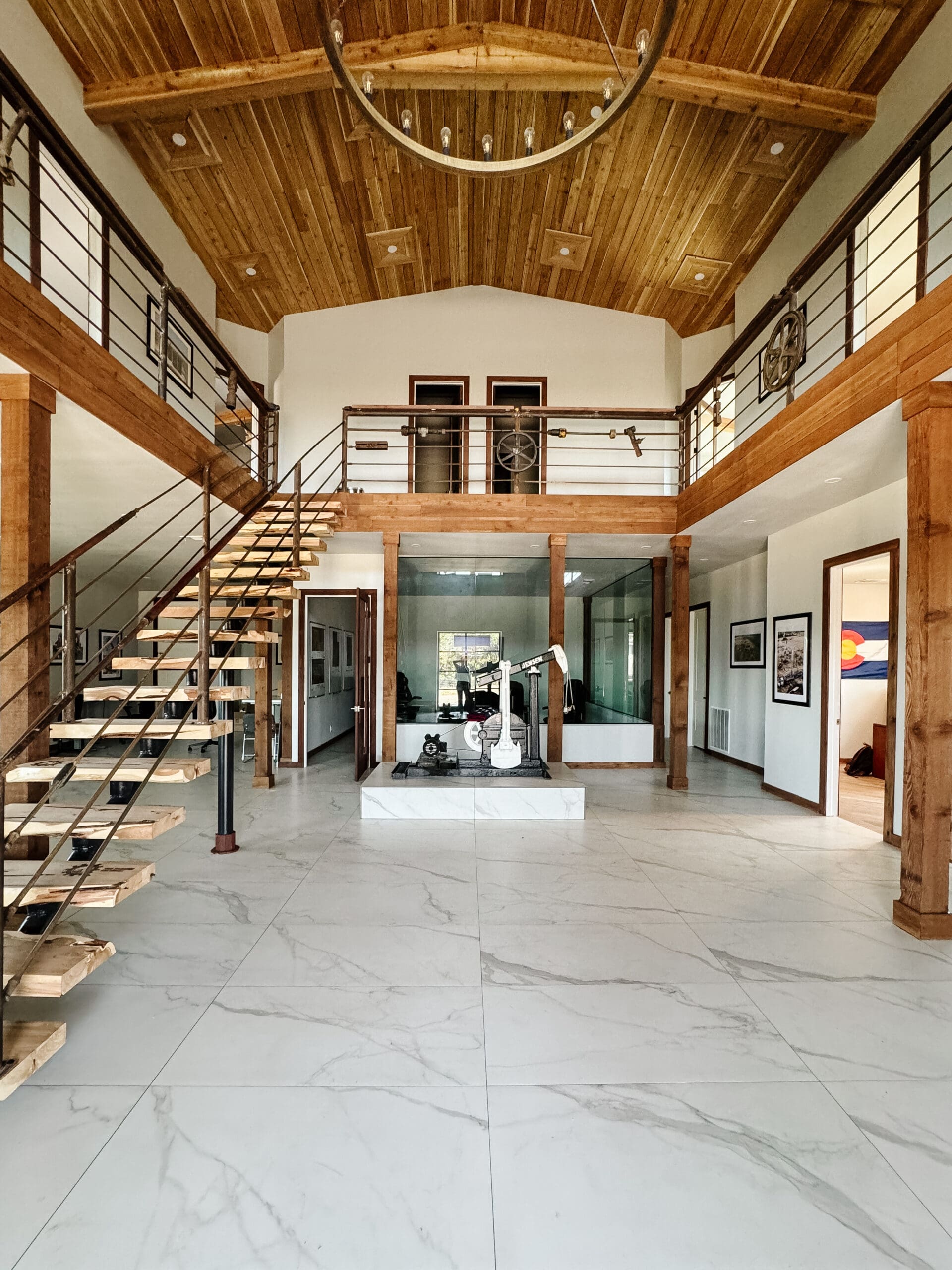 Open steel staircase in a modern barndominium interior