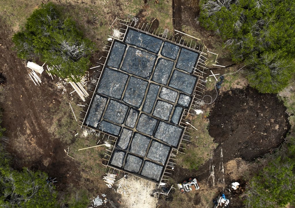 Overhead view of engineered grid foundation forms before a concrete pour