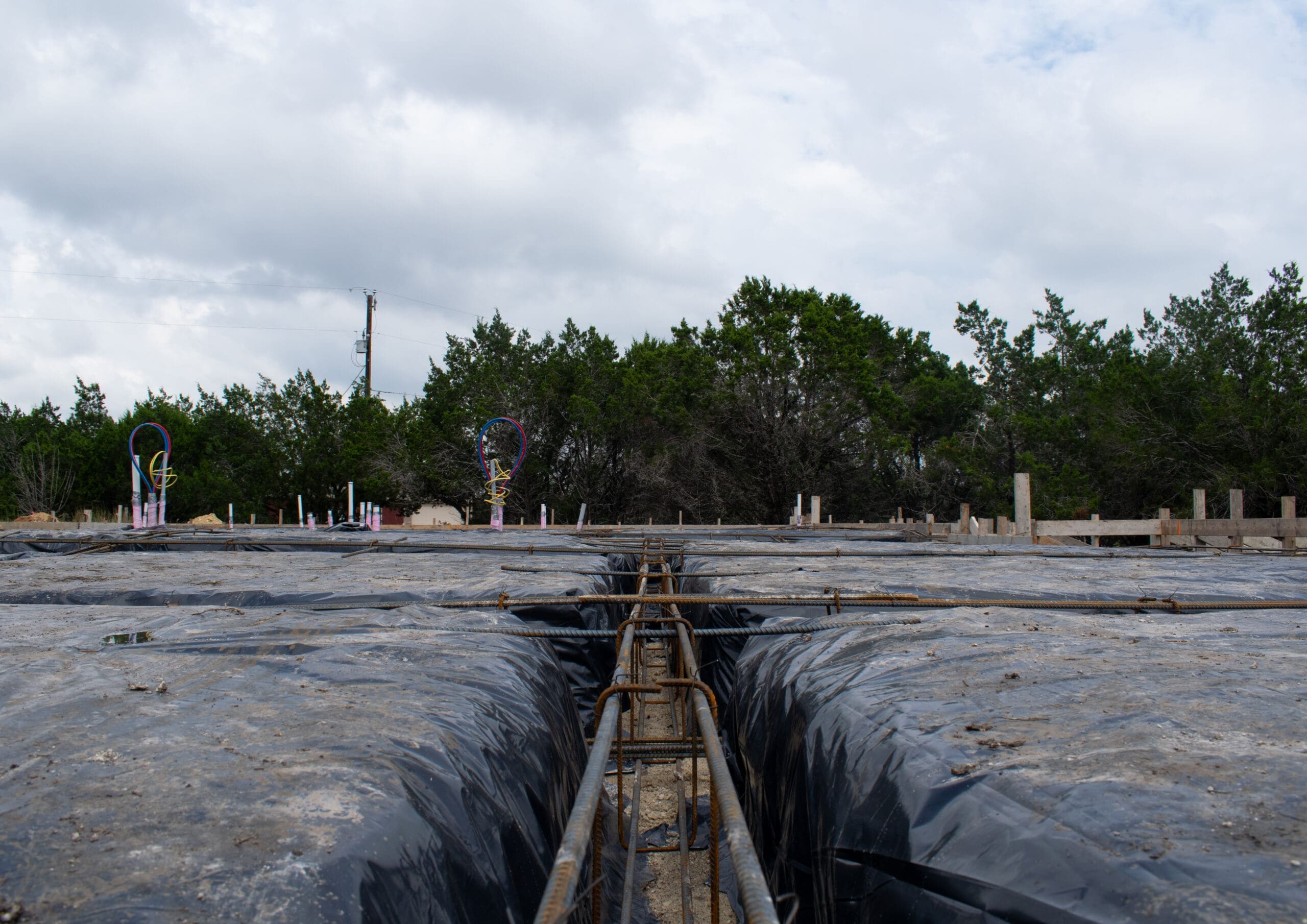 Foundation forms with post-tension layout before a concrete pour