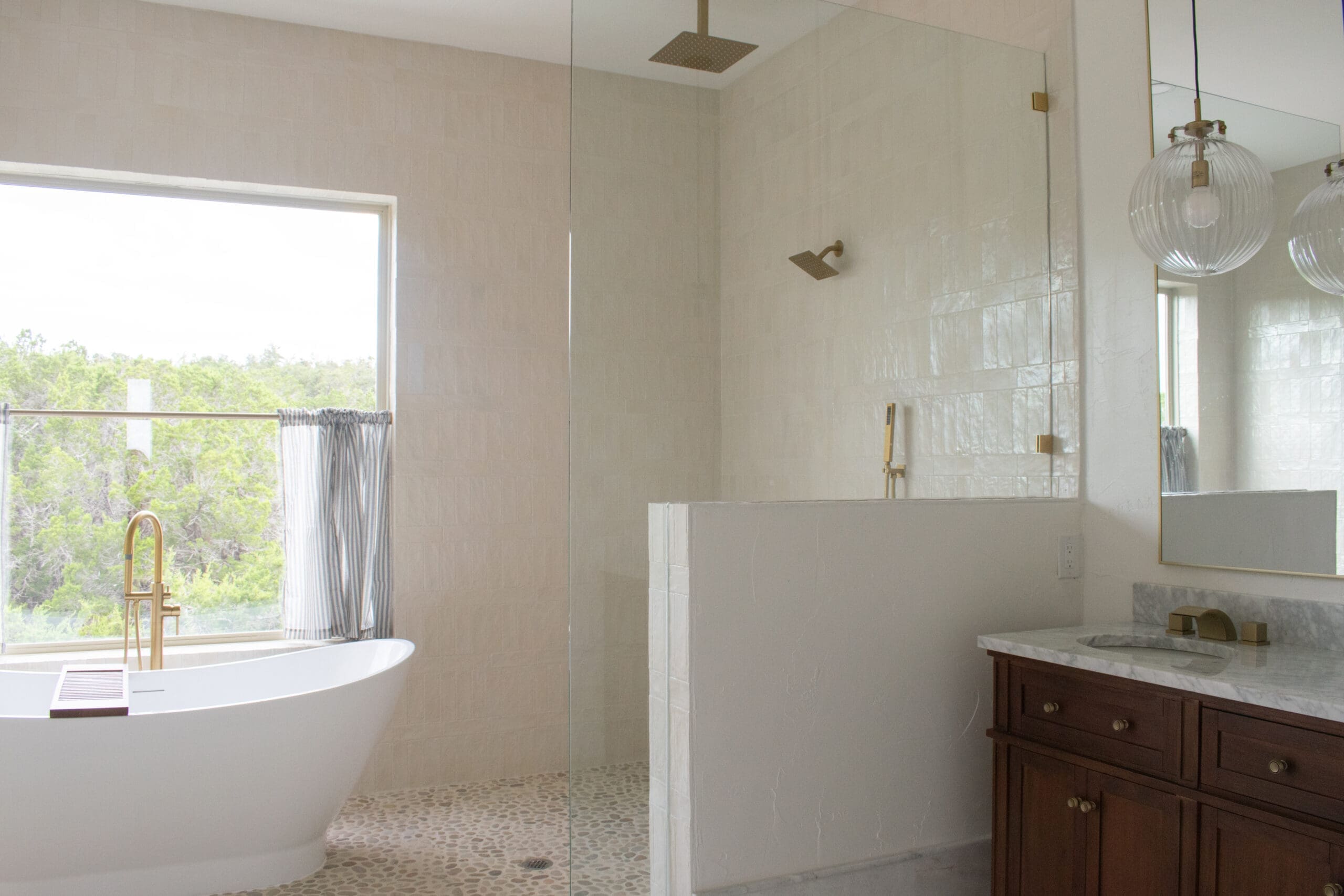 Remodeled bathroom with walk-in shower and garden window