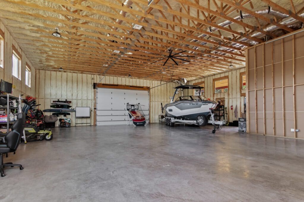 Insulated Boat Barn shop interior with epoxy floor and boat storage